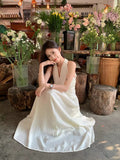 French Gentle White Hanging Neck Sling Dress Women's Summer 2026 New Temperament Seaside Holiday Dress
