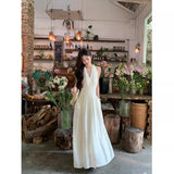 French Gentle White Hanging Neck Sling Dress Women's Summer 2026 New Temperament Seaside Holiday Dress