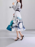 2025 New High-Rise Half-Dress Woman Tight Waist Ink Print Design Sense A-Character Skirt In The Long Folded Skirt