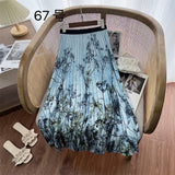 2025 New High-Rise Half-Dress Woman Tight Waist Ink Print Design Sense A-Character Skirt In The Long Folded Skirt