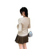 Unique Fake Two-Piece Hanging Neck Long-Sleeved Knitted Bottom Shirt Women Autumn 2025 New High-End Sesame V-Neck Top