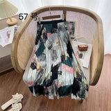 2025 New High-Rise Half-Dress Woman Tight Waist Ink Print Design Sense A-Character Skirt In The Long Folded Skirt