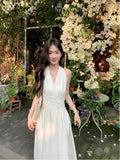 French Gentle White Hanging Neck Sling Dress Women's Summer 2026 New Temperament Seaside Holiday Dress