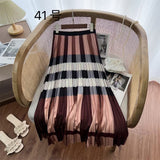 2025 New High-Rise Half-Dress Woman Tight Waist Ink Print Design Sense A-Character Skirt In The Long Folded Skirt