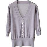 Short-Sleeved Ice Silk Knitted Women's 2026 Summer New Pearl Buckle Design Small Loose Thin Top