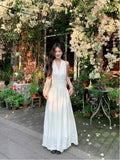 French Gentle White Hanging Neck Sling Dress Women's Summer 2026 New Temperament Seaside Holiday Dress