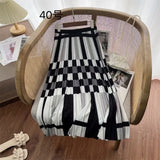 2025 New High-Rise Half-Dress Woman Tight Waist Ink Print Design Sense A-Character Skirt In The Long Folded Skirt